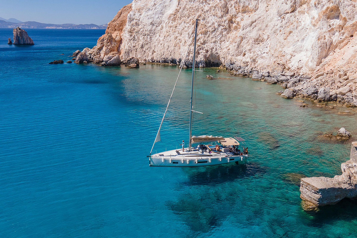 2023 yachting hotspots – A bay dotted with yachts in Milos, Greece
