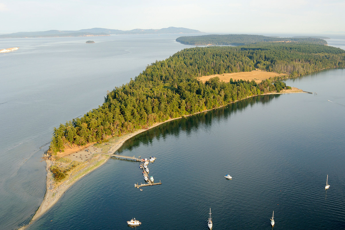 2023 yachting hotspots – A stretch of forest dividing the deep blue sea in the Gulf Islands, Canada