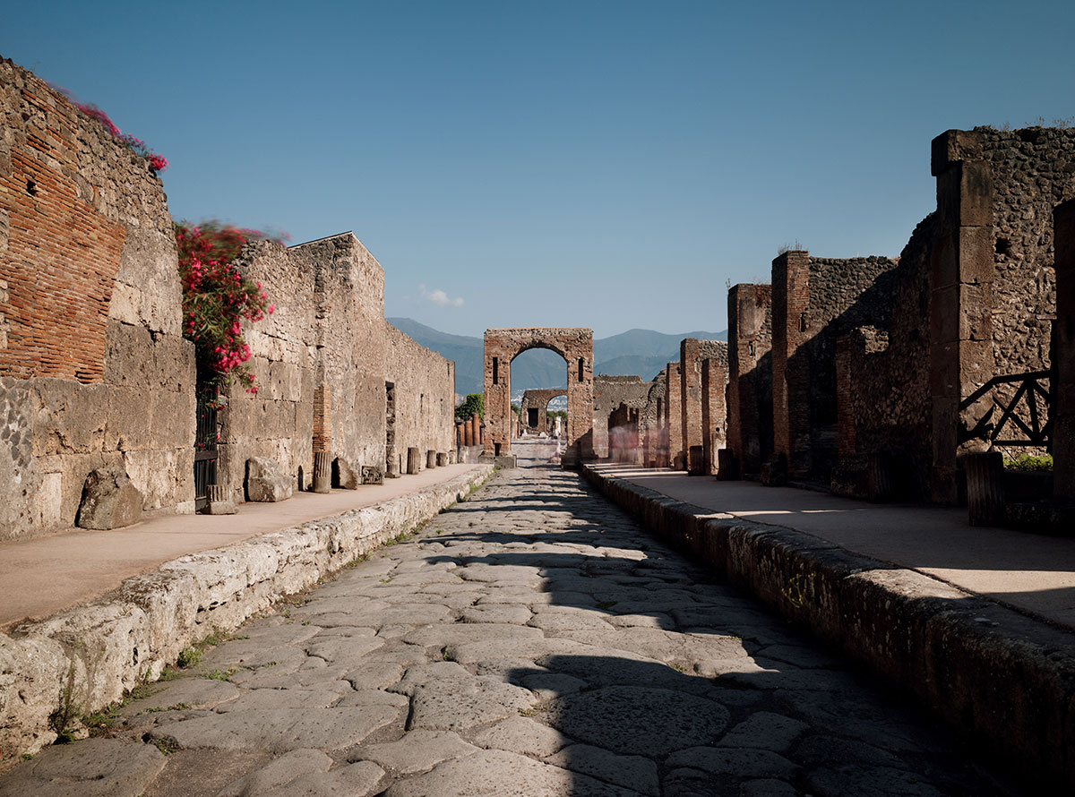 About Pompeii - The Via de Mercurio runs down to an archway built in honour of the Emperor Caligula